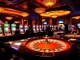 Experience the thrill at TK88 Casino with vibrant gaming tables and lively dealers engaging players.