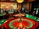 Players engaging with the LUCK8 APP while enjoying an exciting casino atmosphere with roulette and poker.