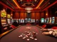 Experience the thrill of gambling with NO HU88 at a luxurious online casino, featuring vibrant tables and slot machines.